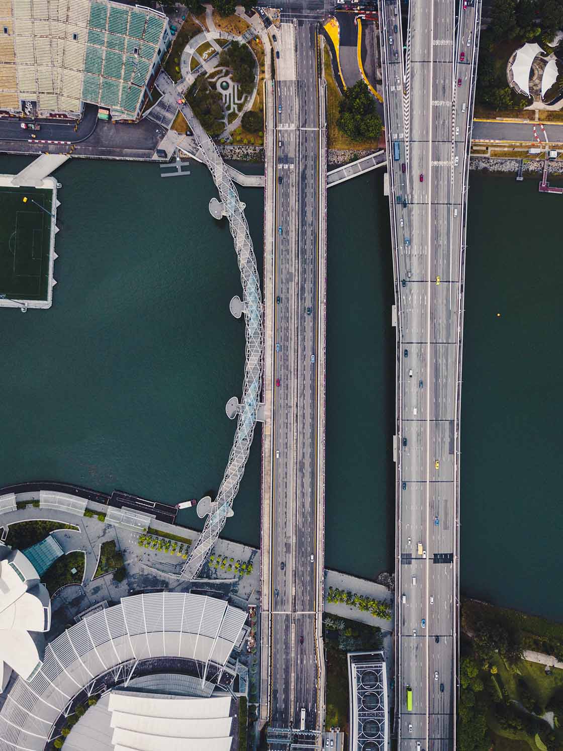 Picture of a bridge with numerous cars driving past